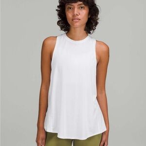 Lululemon All Tied Up Tank Top in White with Red “E” insignia on left shoulder